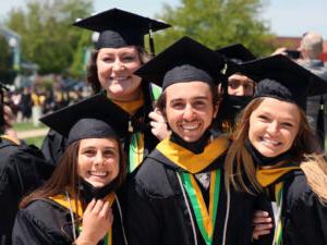 group of graduates in caps and gowns